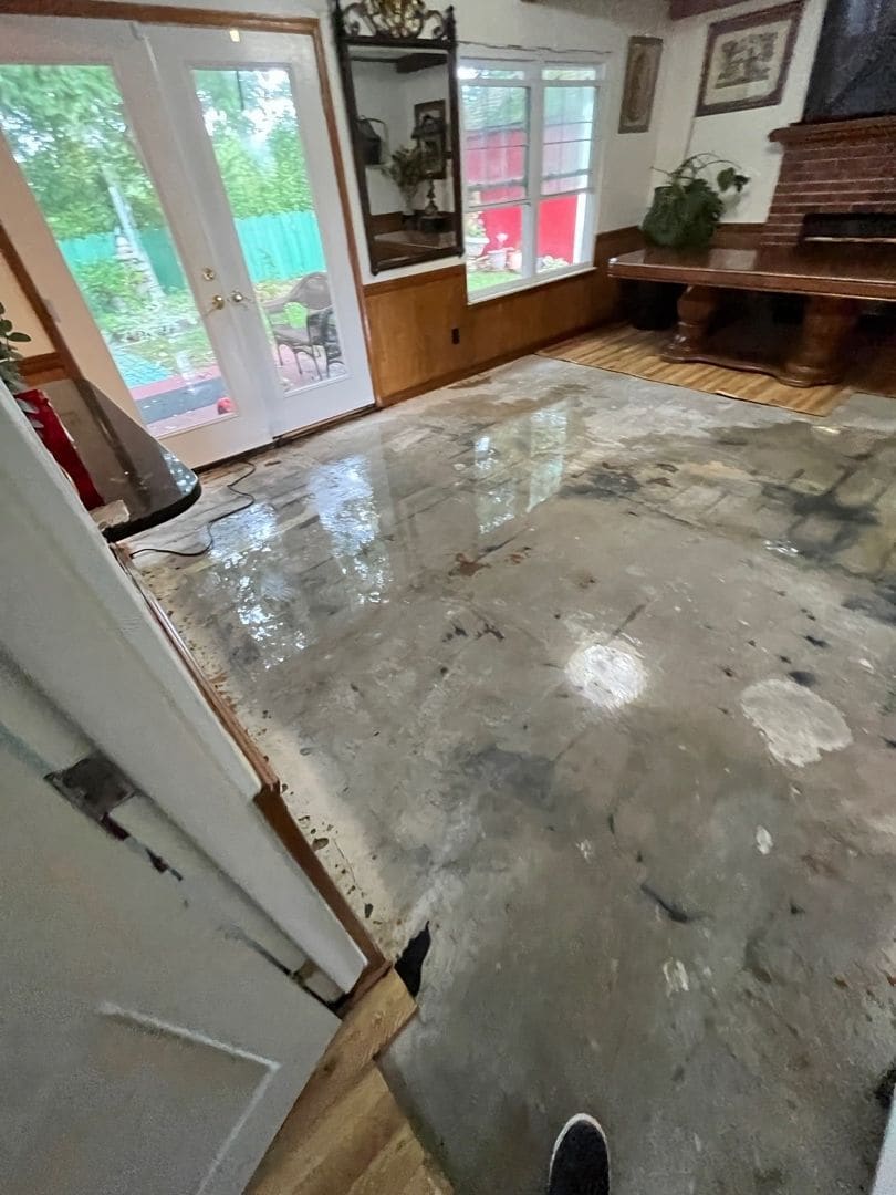 Living room floor stripped to concrete after flood water